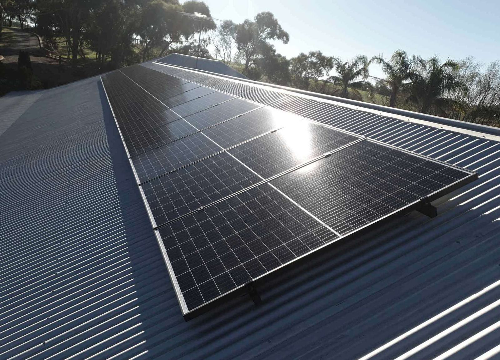 Commercial solar array across a corrugated steel roof