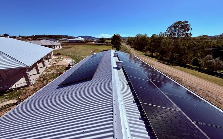 Rooftop solar array on a steel roof